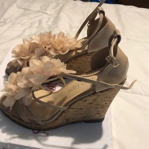 Beige cork wedges with silk-like florals.